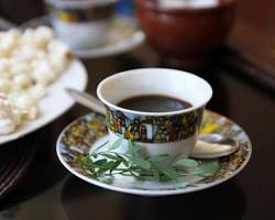 small cups of coffee being served during the Ethiopian coffee ceremony