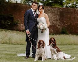 couple with their pet at their weddingの画像