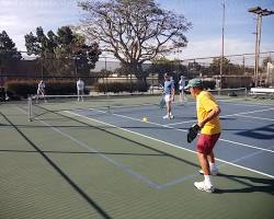 Image of people playing pickleball in a city park