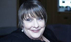 At home with Kathy Burke. What joy! Especially on a day like today. Through the kitchen window we watch the rain tip down on her leafy patio garden. - Kathy-Burke-008