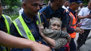 At least 95 killed and hundreds missing after flash floods in Nepal and China
