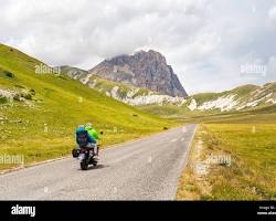 Immagine di motorcycle riding through a scenic mountain road in Abruzzo
