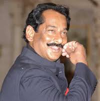 Dilip Singh Judeo who was sworn in as Minister of State twirls his moustache after he ... - nat1