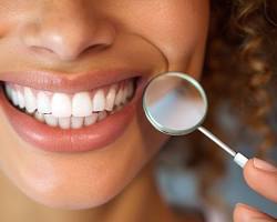 Image of happy patient smiling with a perfect set of teeth