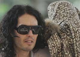 Funnyman Russell Brand was spotted meditating at a Hare Krishna temple in Aldenham here. The 38-year-old comedian was pictured sitting barefoot with closed ... - Russell-read-abc