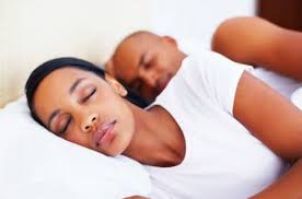 When it comes to getting a full night&#39;s rest, black Americans are more likely to get too little snooze-time than white American adults. - sleeping-woman-and-man