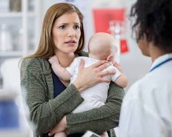 Image of concerned parent with a child