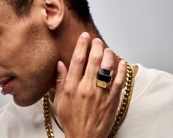 Image of man wearing a chunky signet ring