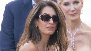 George and Amal Clooney make a rare appearance with twins Ella and Alexander as Amal stuns in elegant black dress