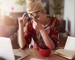 Image of someone looking stressed while looking at apartment listings