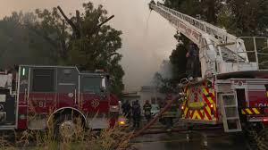 Firefighters battle house fire near Winters