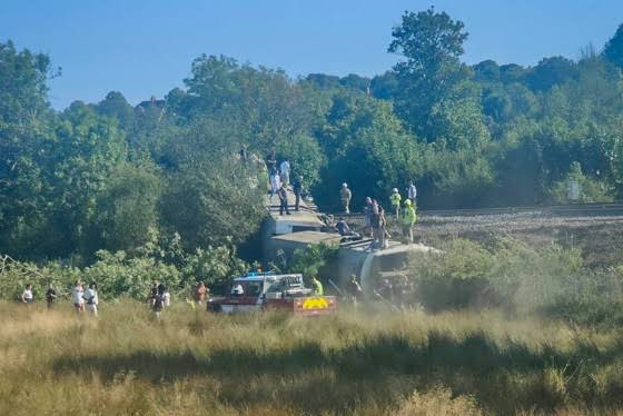 Passenger train derails and flips on its side in southern England, injuring 20; major incident declared as emergency response continues