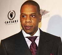 Despite having sold several million discs and served as president of Def Jam Recordings under his alias, Jay-Z still gets pegged as Shawn Carter. - Jay-suit150