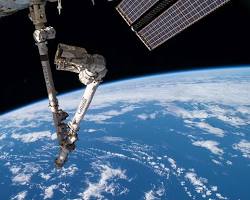 Image of Canadarm in action on the International Space Station