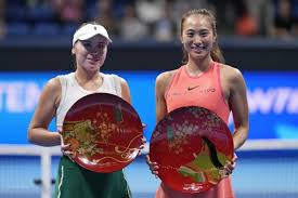 Zheng Qinwen defeats wild card Sofia Kenin to win in Tokyo and clinch WTA 
Finals berth