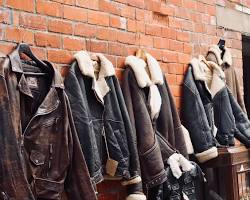Leather jackets hanging on sturdy wooden coat hangers