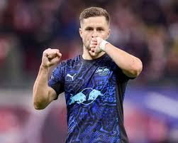 RB Leipzig's Austrian midfield star Christoph Baumgartner on his UEFA Champions League qualification hopes, facing Lionel Messi at the World Cup and mentoring Yan Diomande