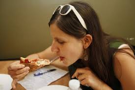 Frances Micklow Sara Rutkowski enjoys a slice at Amici Pizzeria in Raritan. - 9960068-large