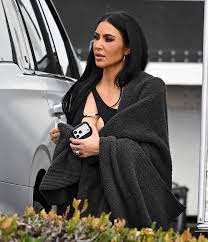 Kim Kardashian Goes Full Showgirl in a Jewel-Covered, Corset-Style Bodysuit and Feathered Headdress