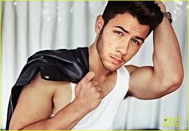 About this photo set: Nick Jonas flexes his gigantic arm muscles in this new feature of him and his brothers - Joe and Kevin - in Out magazine&#39;s latest ... - nick-jonas-shows-off-huge-muscles-for-jonas-brothers-out-feature-01