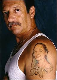 George Henrique, a senior investigator with the New York City Board of Education. His tattoo was copied from a photogragh of his daughter, Michelle, ... - tattoos_04