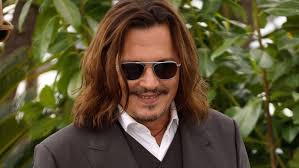 Dental health: Johnny Depp flashes new smile after fixing his 'rotting' 
teeth