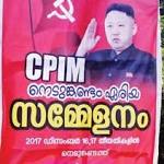 'flexes' muscles with Jong-Un posters