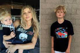 Fergie’s son Axl standing with Josh Duhamel and family at Universal Studios Hollywood