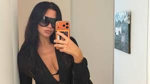 Dua Lipa Leaves Her Cutout Gucci Top Undone for a Deeply Plunging Look