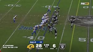 Los Angeles Rams running back Blake Corum weaves his way through Las Vegas Raiders defenders for 15-yard gain