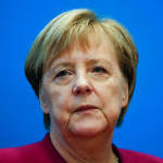 Merkel urges companies switch focus