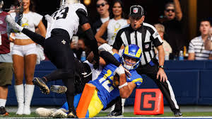 Jaxson Dart, rising star quarterback in the NFL, showcasing talent on the field