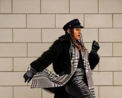 Image of Winter outfit with faux fur coat, dress pants, and heels
