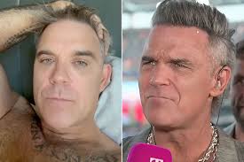 Robbie Williams addresses white substance falling on mic during World Cup interview