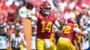 College football players competing during a Week 2 matchup