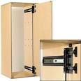 Modified doors slide into the cabinet - watch the original hinges