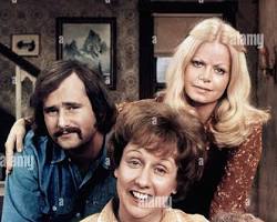 All in the Family 1971 TV series cast Carroll O'Connor as Archie Bunker Jean Stapleton as Edith Rob Reiner Sally Struthers 1970s CBS television stills living room chair, AI generated