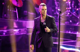 Robbie Williams finally reveals what really fell from his mouth in that viral World Cup clip