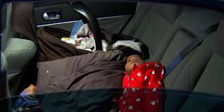 Family with young children sleep in car during winter storm outage