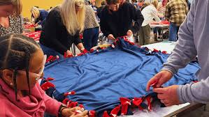 Navy Federal employees craft blankets for veterans