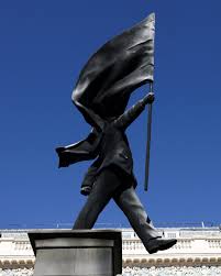 London hails new Banksy statue of man blinded by flag