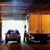 Tractor-trailer rig stuck underneath Hawley Street overpass