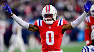 Christian Gonzalez celebrates after signing a record contract with the New England Patriots