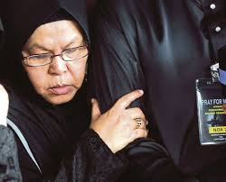 Fatimah Ibrahim, the mother of MH17 first officer Muhd Firdaus Abdul Rahim could not hold back her tears during the funeral at Hilir Perak district Muslim ... - fatimahs.transformed