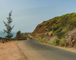Image of Taxi driving on coastal road in Goa