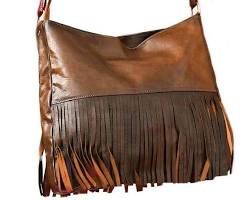 Image of supple brown leather tote with fringe along the edges