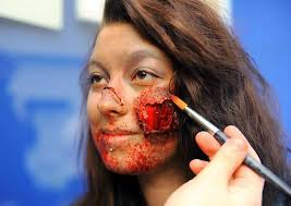 Professional horror make up artist Jenny Jackson creating a zombie look on Jodie Luxton. Picture: James Bass - 3103064530