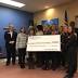 Women Who Care presents $28300 check to Rescue Mission