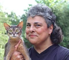 Lisa-Maria Padilla, 52, of Reston with her Abyssinian cat, Racy Mooner - R0918-722_t670