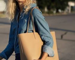 Image of structured leather tote in black and camel color